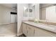 Ensuite bathroom with dual sinks, modern fixtures, and an open view into the bedroom at 5009 Peaceful Pond Ave, Las Vegas, NV 89131