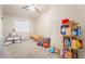 Bright bedroom features natural light and whimsical decorations at 5009 Peaceful Pond Ave, Las Vegas, NV 89131