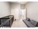 Bedroom offers neutral walls and carpet, alongside space saving furniture at 5009 Peaceful Pond Ave, Las Vegas, NV 89131