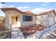 Single-story home featuring an inviting front entrance, large windows, and an attached two-car garage at 5009 Peaceful Pond Ave, Las Vegas, NV 89131