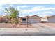 Charming single-story home with desert landscaping, a two-car garage, and a neatly maintained front yard at 5009 Peaceful Pond Ave, Las Vegas, NV 89131