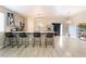 Stylish kitchen with an island, bar stool seating, stainless steel appliances, and ample counter space at 5009 Peaceful Pond Ave, Las Vegas, NV 89131
