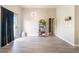 Open living space with light wood flooring, high ceilings, and neutral paint throughout the home at 5009 Peaceful Pond Ave, Las Vegas, NV 89131