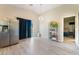 Open living space with light wood flooring, high ceilings, and natural light flowing in from the backyard at 5009 Peaceful Pond Ave, Las Vegas, NV 89131