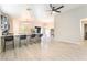 Inviting living space featuring an open floor plan, wood floors, neutral walls, and modern lighting at 5009 Peaceful Pond Ave, Las Vegas, NV 89131
