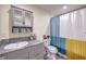 Bathroom featuring granite countertops, a modern vanity and a shower with colorful curtain at 5093 Sun Valley Dr, Las Vegas, NV 89122