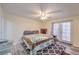 Bedroom featuring neutral paint, hardwood floors, ceiling fan, and access to outdoors at 5093 Sun Valley Dr, Las Vegas, NV 89122