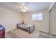 Cozy bedroom with ceiling fan, large window, and mirrored closet doors is brightly lit and comfortable at 5093 Sun Valley Dr, Las Vegas, NV 89122