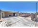Open carport area with ample space, featuring a concrete floor, lighting, and functional storage at 5093 Sun Valley Dr, Las Vegas, NV 89122