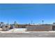 Exterior shot of the home showcasing its facade, driveway, and fenced yard at 5093 Sun Valley Dr, Las Vegas, NV 89122
