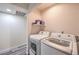The laundry room features a side by side washer and dryer at 5093 Sun Valley Dr, Las Vegas, NV 89122