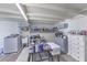 Unfinished basement area featuring open storage, utility sink and appliances at 5093 Sun Valley Dr, Las Vegas, NV 89122