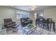 Cozy living and dining area with wood-look flooring, neutral paint, and a relaxing atmosphere at 5093 Sun Valley Dr, Las Vegas, NV 89122