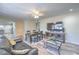 Open concept living room features ceiling fan, hardwood floors, and large television, perfect for entertaining at 5093 Sun Valley Dr, Las Vegas, NV 89122