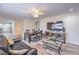Open concept living room features ceiling fan, hardwood floors, and large television, perfect for entertaining at 5093 Sun Valley Dr, Las Vegas, NV 89122