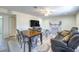Inviting living room featuring a dining table, electric fireplace, and a comfortable reclining sofa at 5093 Sun Valley Dr, Las Vegas, NV 89122