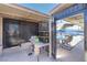 The covered patio features a table, chairs, and storage and provides easy access to the pool area at 5093 Sun Valley Dr, Las Vegas, NV 89122