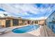 Backyard pool features patio area for outdoor dining and relaxing, with a painted wall accent at 5093 Sun Valley Dr, Las Vegas, NV 89122