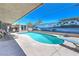 Inviting backyard pool with a diving board, complemented by a mural backdrop at 5093 Sun Valley Dr, Las Vegas, NV 89122
