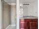 Bathroom featuring glass shower, granite countertop, and a large mirror at 5200 Indian River Dr # 301, Las Vegas, NV 89103