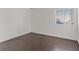 Bedroom displaying hardwood floors and a window with blinds at 5200 Indian River Dr # 301, Las Vegas, NV 89103