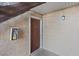 Condo entrance with dark brown door, visible unit number, and safety equipment at 5200 Indian River Dr # 301, Las Vegas, NV 89103
