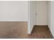 Condo entrance featuring new hard wood floors and freshly painted white door at 5200 Indian River Dr # 301, Las Vegas, NV 89103