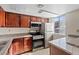 Well-lit kitchen offering stainless steel appliances, light granite counters, and ample cabinet storage at 5200 Indian River Dr # 301, Las Vegas, NV 89103