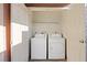 Laundry room featuring a washer and dryer, and two doors at 5200 Indian River Dr # 301, Las Vegas, NV 89103
