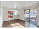 Inviting living area offering hardwood floors, access to kitchen, and bright light from sliding glass doors at 5200 Indian River Dr # 301, Las Vegas, NV 89103