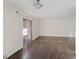 Well-lit living room featuring hardwood floors, neutral wall paint, and sliding glass door access at 5200 Indian River Dr # 301, Las Vegas, NV 89103