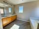 Bright bathroom with double vanity, soaking tub, and wood look tile at 5308 Hollyridge St, North Las Vegas, NV 89081