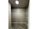 Walk-in closet with wood-look tile and multiple shelves on walls at 5308 Hollyridge St, North Las Vegas, NV 89081