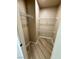 Walk-in closet with wood-look tile and multiple shelves on walls at 5308 Hollyridge St, North Las Vegas, NV 89081