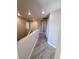 Hallway with wood-look flooring, neutral paint, and access to multiple rooms at 5308 Hollyridge St, North Las Vegas, NV 89081