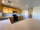 Bright kitchen featuring wood cabinetry, modern appliances and countertops at 5308 Hollyridge St, North Las Vegas, NV 89081