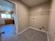 Laundry room with modern hookups, a wire shelf and updated fixtures at 5308 Hollyridge St, North Las Vegas, NV 89081