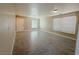 Bright living room with tile floors, neutral walls, and large windows offering natural light at 5308 Hollyridge St, North Las Vegas, NV 89081