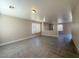 Open-concept living space with tile floors, neutral tones, and plenty of natural light at 5308 Hollyridge St, North Las Vegas, NV 89081