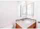Bathroom featuring a wood vanity with a marbled countertop and multiple mirrors at 5673 Coaldale Pl, Las Vegas, NV 89110