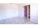 Bedroom showcasing tile floors and a large closet at 5673 Coaldale Pl, Las Vegas, NV 89110