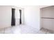 Bedroom with tile floors and modern window coverings at 5673 Coaldale Pl, Las Vegas, NV 89110