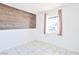 This bedroom features tile flooring and natural light at 5673 Coaldale Pl, Las Vegas, NV 89110