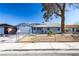 Charming single story home featuring a xeriscaped front yard and mature tree at 5673 Coaldale Pl, Las Vegas, NV 89110