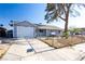 Quaint one-story home with attached garage, long driveway and fully fenced front yard at 5673 Coaldale Pl, Las Vegas, NV 89110