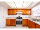 Updated kitchen with stainless steel appliances, marble countertops and wooden cabinets at 5673 Coaldale Pl, Las Vegas, NV 89110