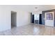 This living room features tile flooring and a neutral color palette at 5673 Coaldale Pl, Las Vegas, NV 89110