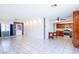 Spacious living room featuring tile flooring, a neutral color palette and ample natural light at 5673 Coaldale Pl, Las Vegas, NV 89110