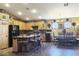 Open concept kitchen with an island and seating overlooks dining area, and black appliances at 5929 Gentle Creek Ln, North Las Vegas, NV 89031