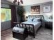 Comfortable main bedroom with laminate floors, soft natural lighting, and a traditional design at 5929 Gentle Creek Ln, North Las Vegas, NV 89031